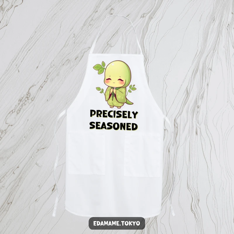 Funny apron displaying a polite edamame in an elegant green kimono with patterns, bowing gracefully, perfect for refined cooking.