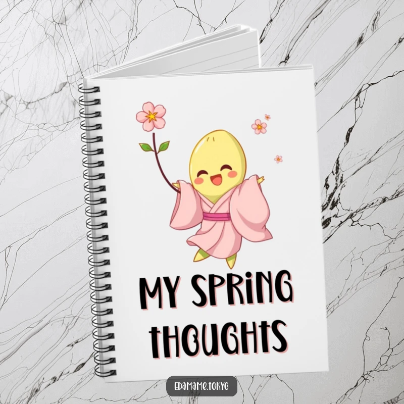 Funny notebook with a cover illustration of an edamame in a pale pink kimono, joyfully twirling with a blossom, ideal for journaling.
